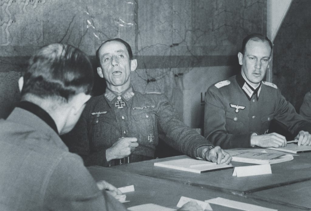 A plenipotentiary for the Wehrmacht and another for the SS (above, center and right) assemble in Caserta, Italy, to sign the surrender documents. Another plus from Wolff: hundreds of Italian paintings were kept out of German hands, avoiding the fate of those below. (Mondadori via Getty Images)