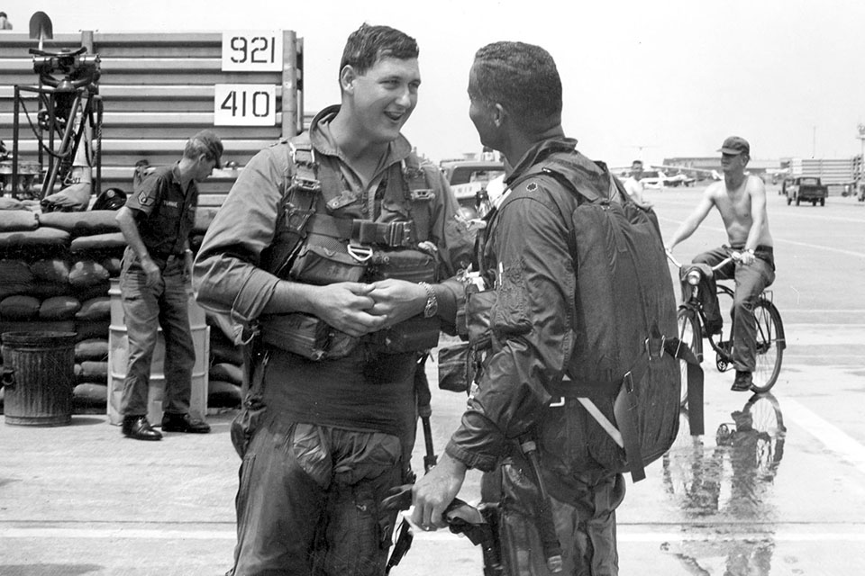 U.S. Air Force Lieutenant Tom Coney (left) talks with his squadron commander, Lt. Col. McGee, after their final sortie in Vietnam. McGee was commander of the 16th Tactical Reconnaissance Squadron in Vietnam.