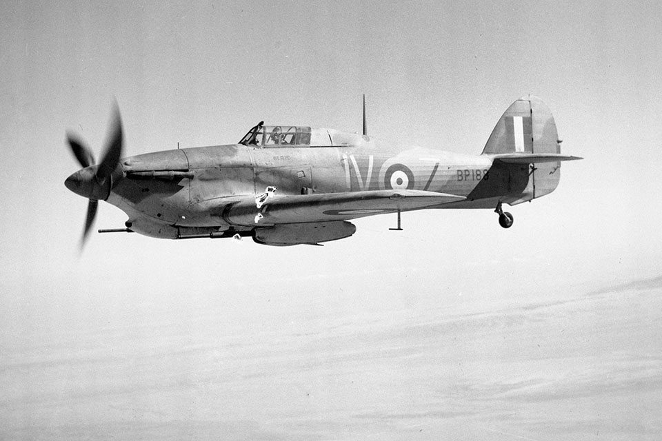 Despite being slowed by its two wing-mounted 40mm Vickers cannons, the Hawker Hurricane IID proved potent against Axis tanks in North Africa. (IWM CM4954)
