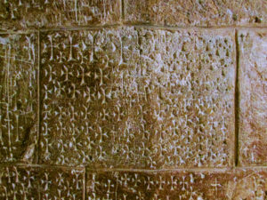 Crosses carved into the wall of the Holy Sepulchre